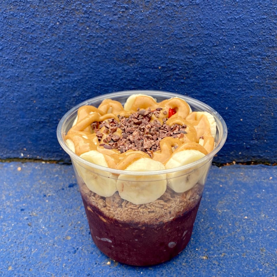 A Twenty Two Juice Bar acai bowl with bananas, peanut butter, and cacao nibs.